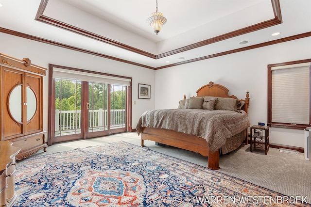 bedroom with crown molding, light colored carpet, a tray ceiling, and access to outside