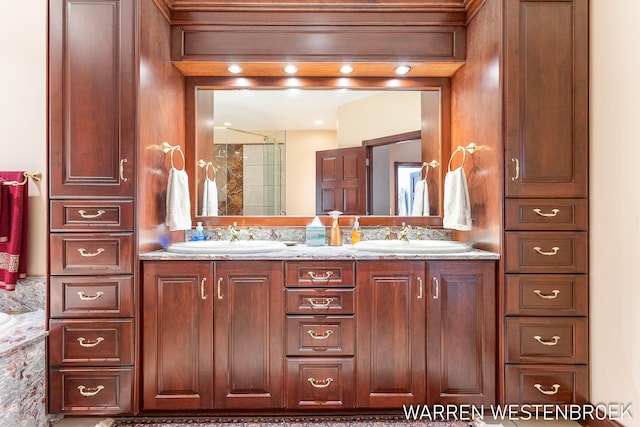 bathroom featuring vanity and a shower with shower door