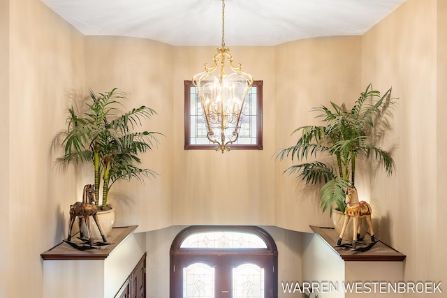 foyer featuring an inviting chandelier