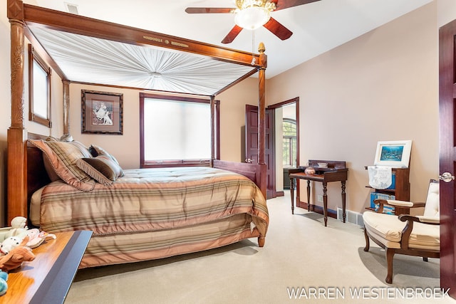 bedroom featuring vaulted ceiling, carpet flooring, and ceiling fan