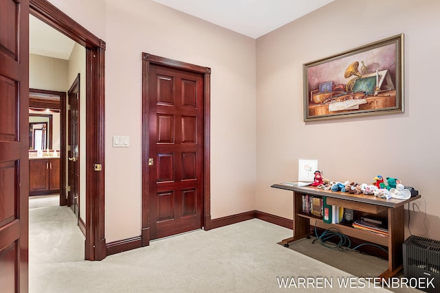 view of carpeted foyer entrance