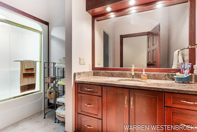 bathroom featuring tile patterned flooring, vanity, and bathtub / shower combination