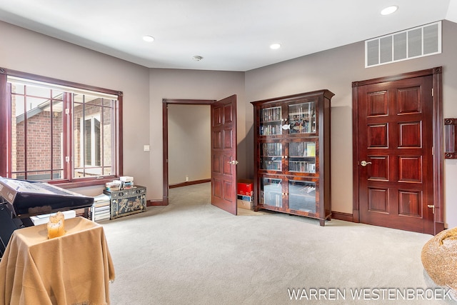 living area with light carpet