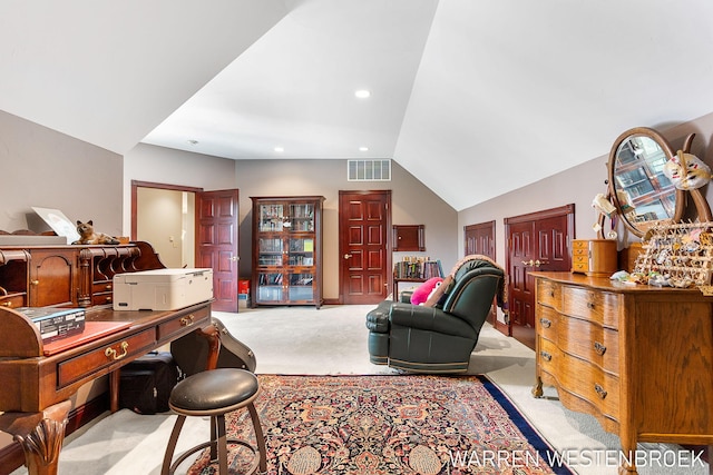 carpeted office space with vaulted ceiling