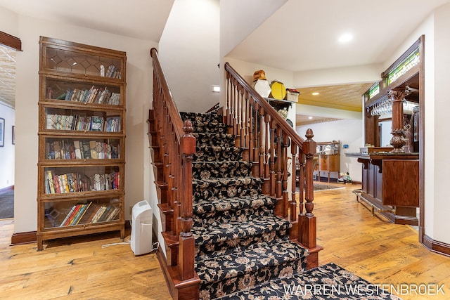 stairway featuring hardwood / wood-style flooring