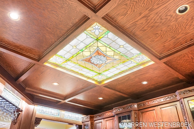 room details with ornamental molding, coffered ceiling, and beam ceiling