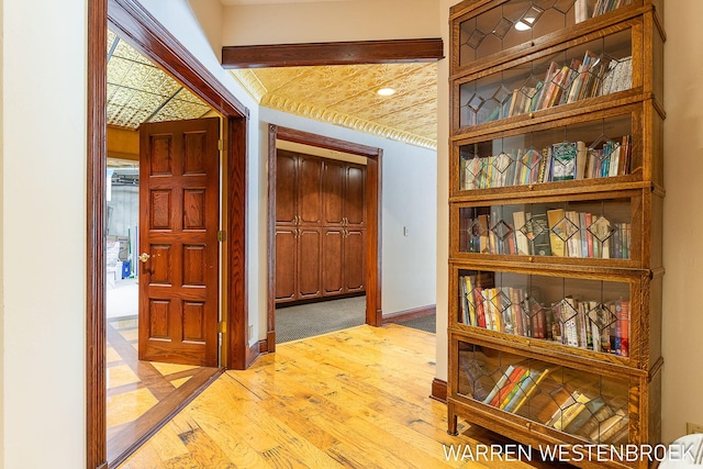 hall with light hardwood / wood-style floors