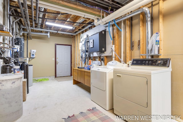 clothes washing area with washer and dryer