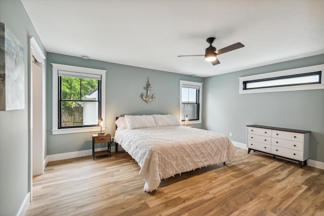 bedroom featuring light wood-type flooring and ceiling fan