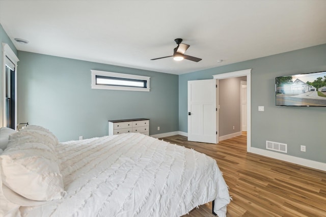 bedroom with hardwood / wood-style floors and ceiling fan