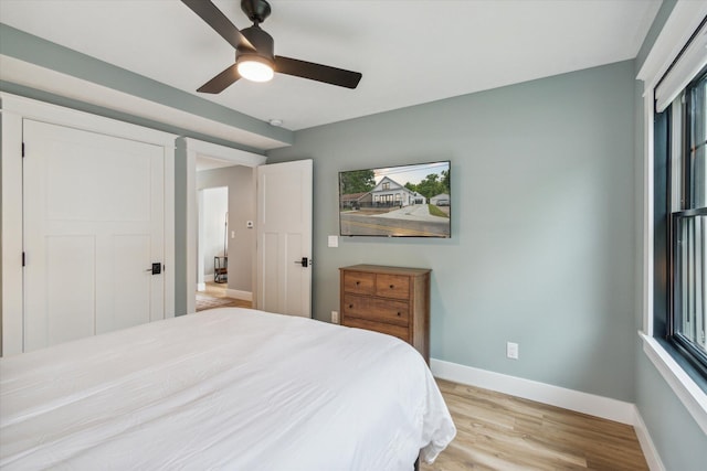 bedroom featuring ceiling fan and light hardwood / wood-style flooring