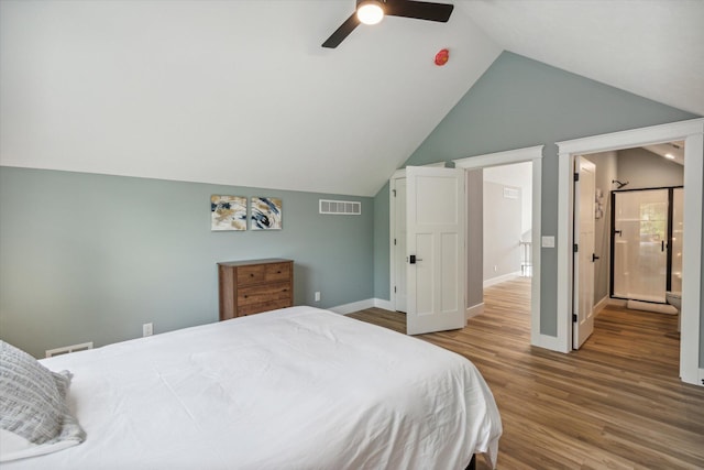 bedroom featuring hardwood / wood-style flooring, vaulted ceiling, and ceiling fan