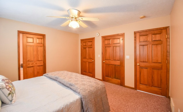 carpeted bedroom featuring ceiling fan