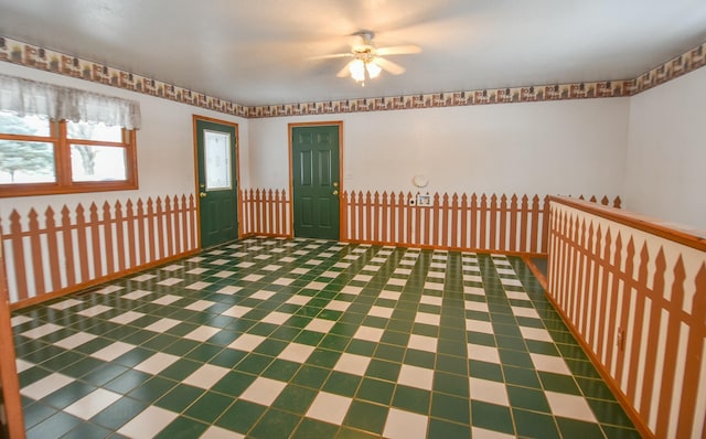 unfurnished room featuring ceiling fan