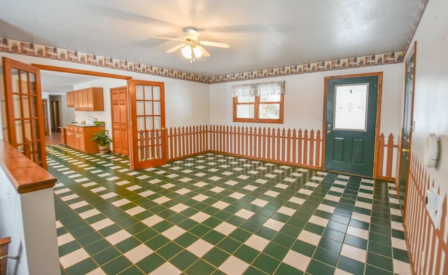 entrance foyer with french doors and ceiling fan