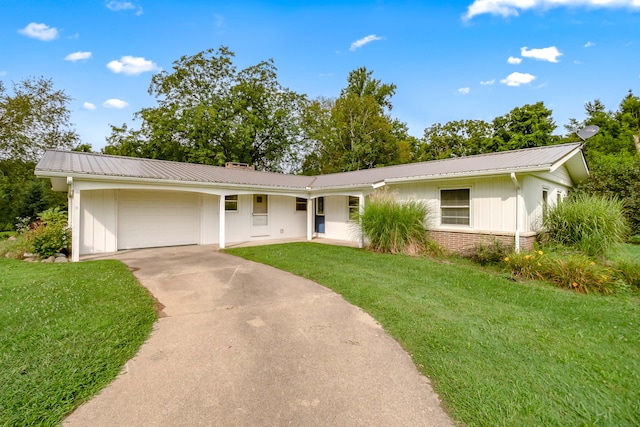 ranch-style home with a garage and a front lawn