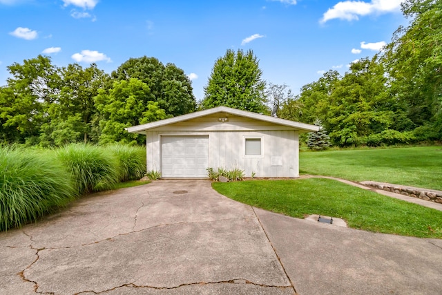 garage featuring a yard