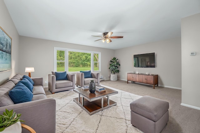 living room featuring light carpet and ceiling fan