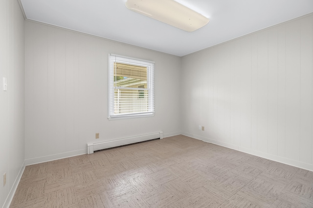 unfurnished room featuring baseboard heating and light parquet flooring