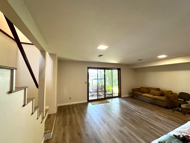 unfurnished living room featuring wood-type flooring