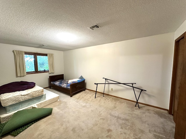 bedroom with visible vents, baseboards, and carpet floors