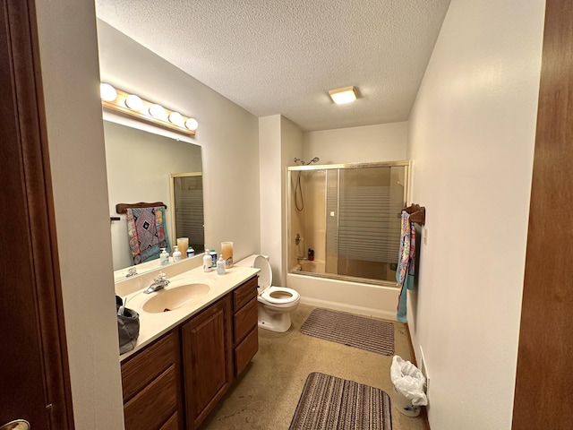 full bathroom with vanity, a textured ceiling, toilet, and enclosed tub / shower combo