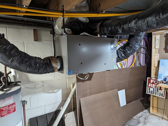 utility room featuring gas water heater