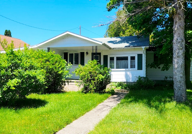 bungalow with a front lawn