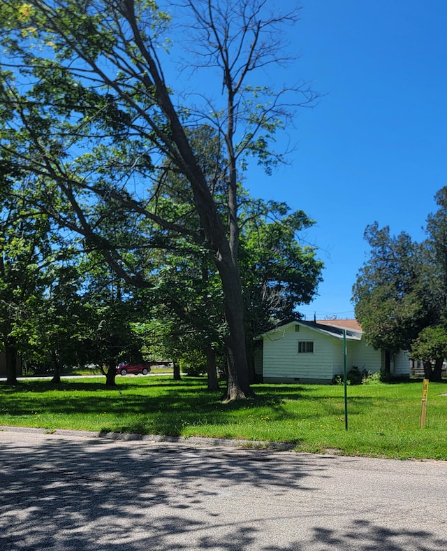 view of home's exterior with a yard