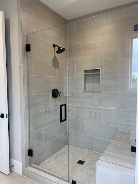 full bathroom with a shower stall