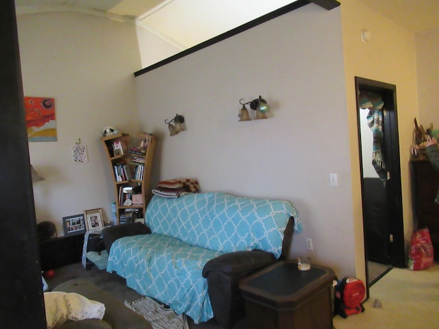 carpeted bedroom featuring lofted ceiling