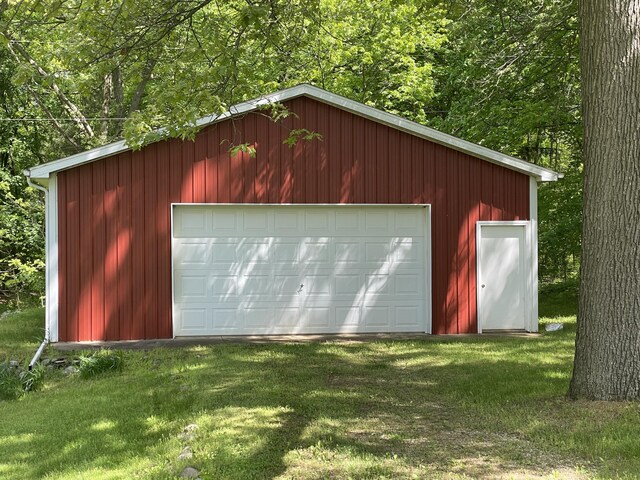 garage featuring a yard