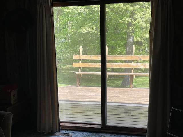 doorway to outside featuring a wealth of natural light