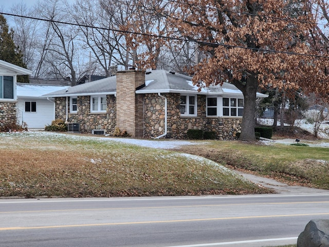 view of side of property featuring central AC unit