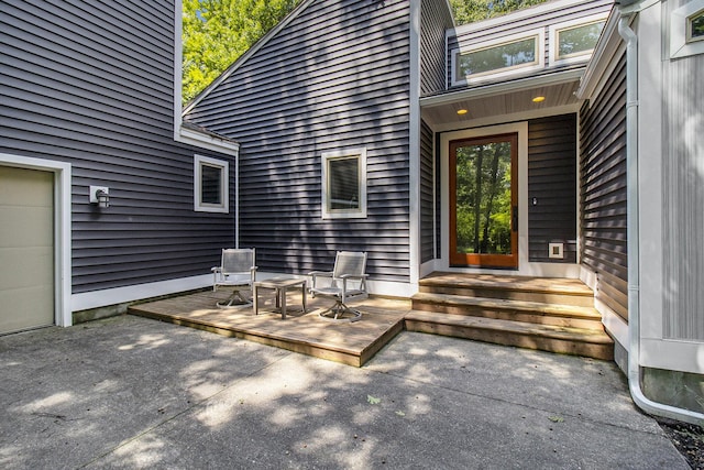 doorway to property with a patio