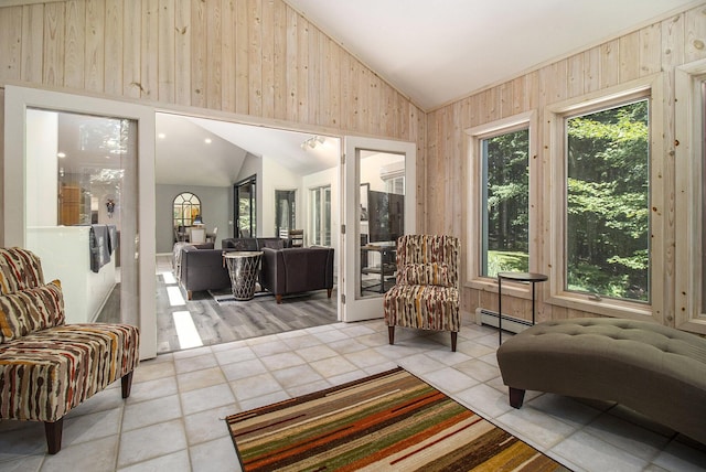 interior space with a baseboard radiator and lofted ceiling