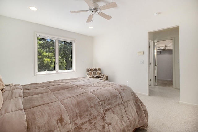 bedroom with recessed lighting, baseboards, light colored carpet, and ceiling fan