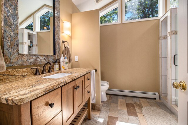 bathroom featuring walk in shower, toilet, vanity, a baseboard radiator, and vaulted ceiling