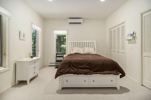 bedroom with a baseboard radiator, light carpet, baseboards, and a wall unit AC