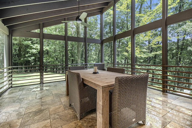 sunroom / solarium featuring a ceiling fan and lofted ceiling