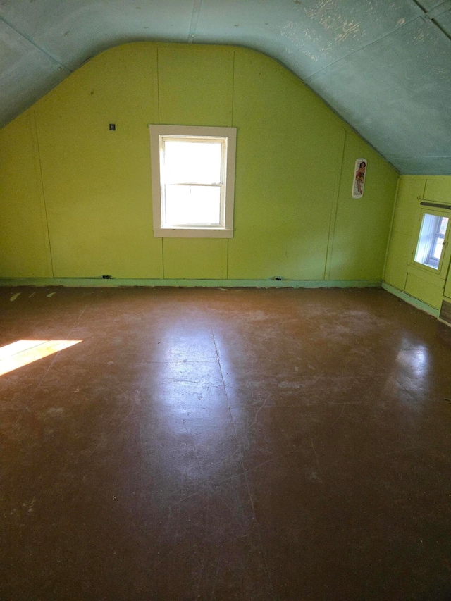 additional living space with vaulted ceiling