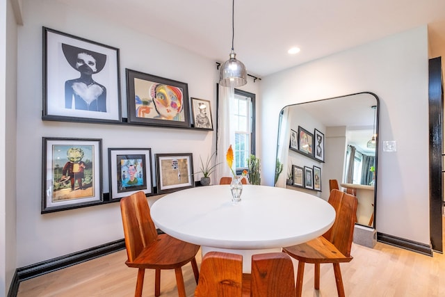 dining area with hardwood / wood-style floors