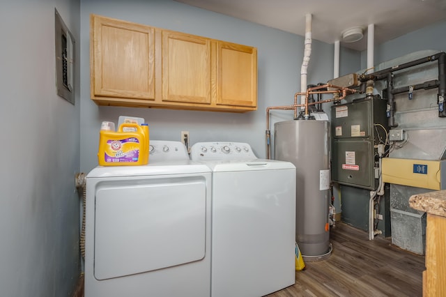 washroom with cabinets, independent washer and dryer, gas water heater, and dark wood-type flooring