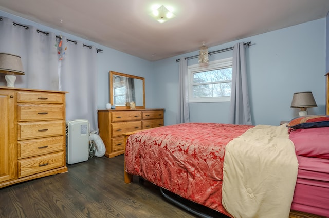 bedroom featuring dark wood-type flooring