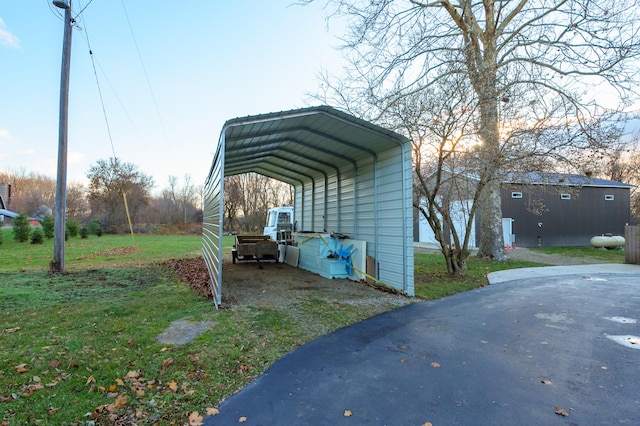 exterior space featuring a carport and a lawn