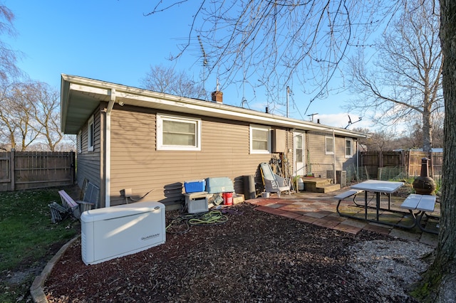 back of house featuring a patio