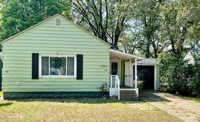 bungalow with a front lawn