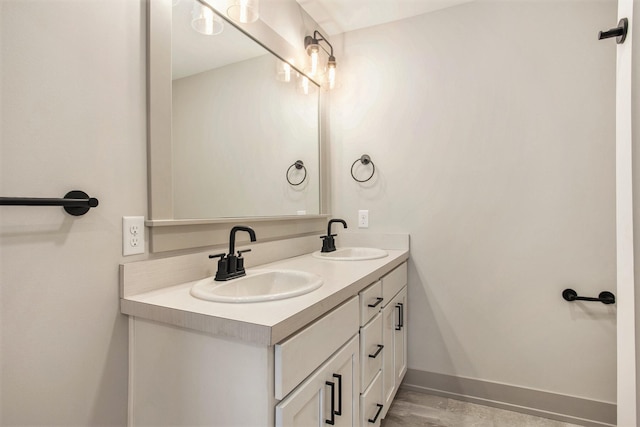 bathroom featuring wood-type flooring and double sink vanity