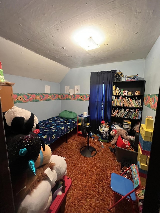 bedroom featuring vaulted ceiling and carpet floors