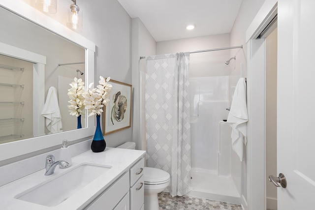 bathroom featuring tile patterned floors, a shower, toilet, and vanity